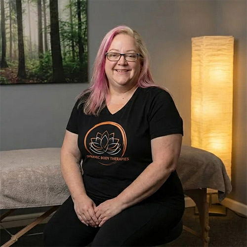 Samantha sitting and smiling at camera